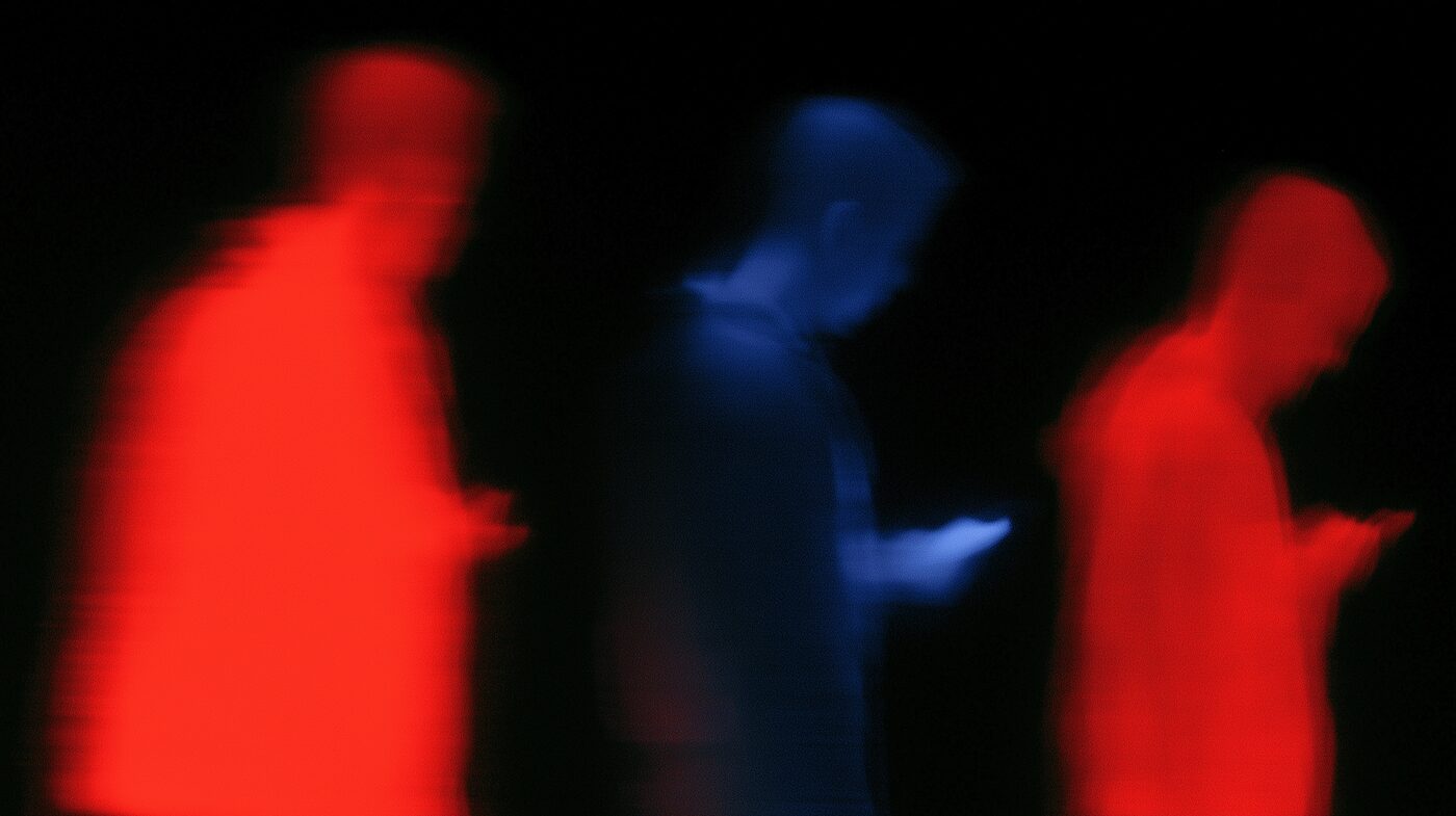 Thermal image of a crowd looking at phone screens