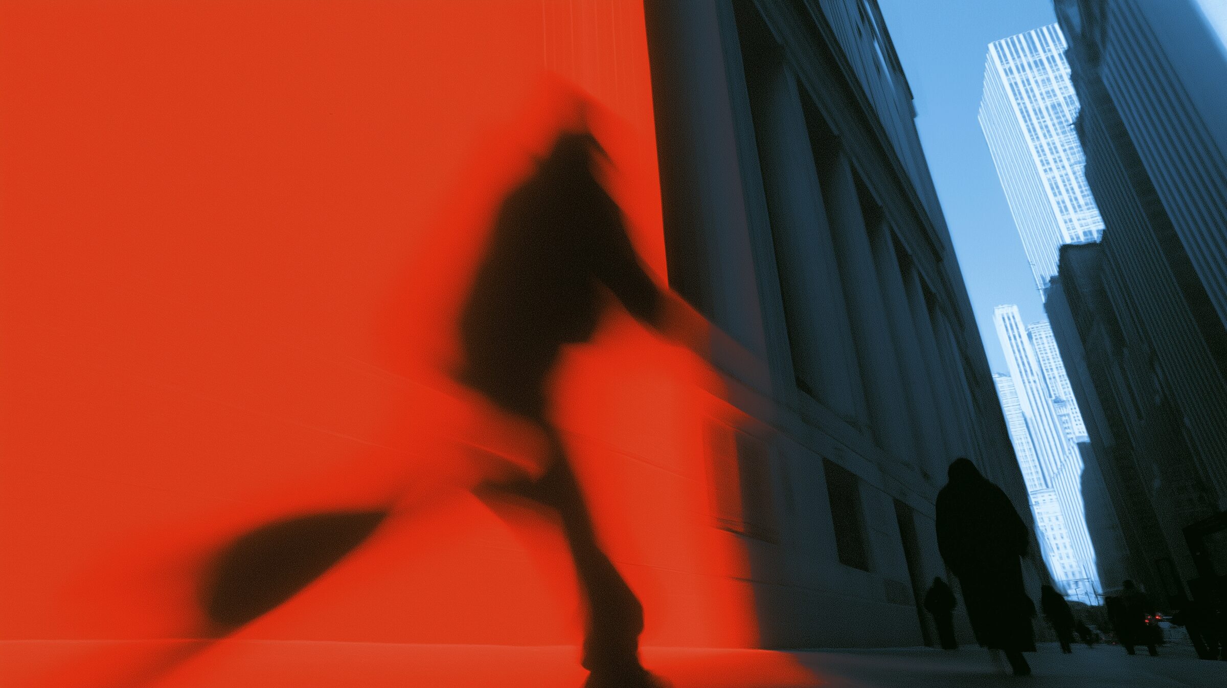 Thermal imaging of a figure walking through a financial district