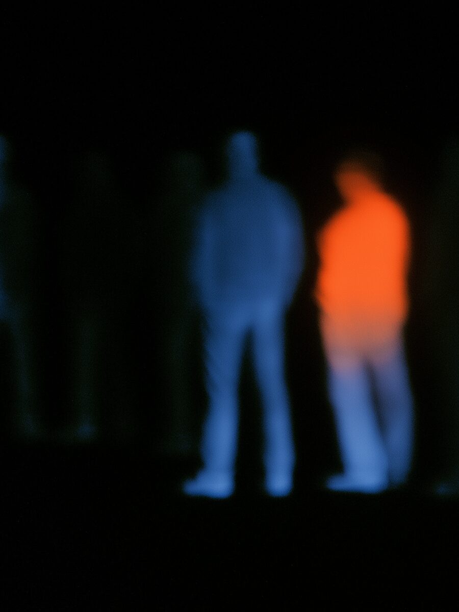 Thermal image of figures in a dark room